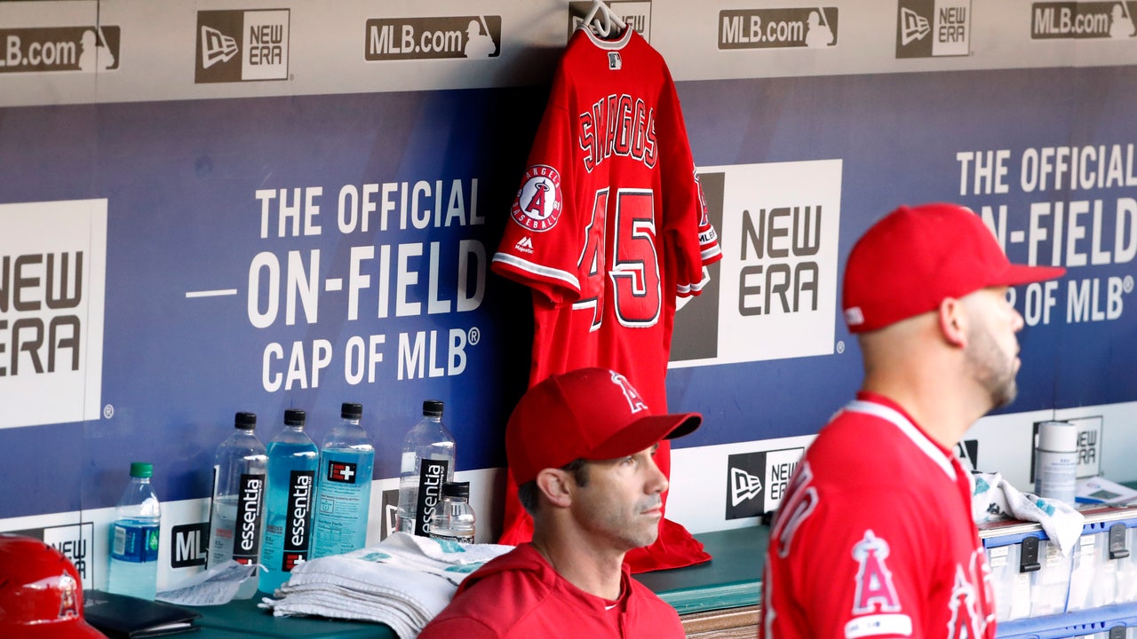 Grieving Angels beat Rangers 9-4 day after death of Skaggs